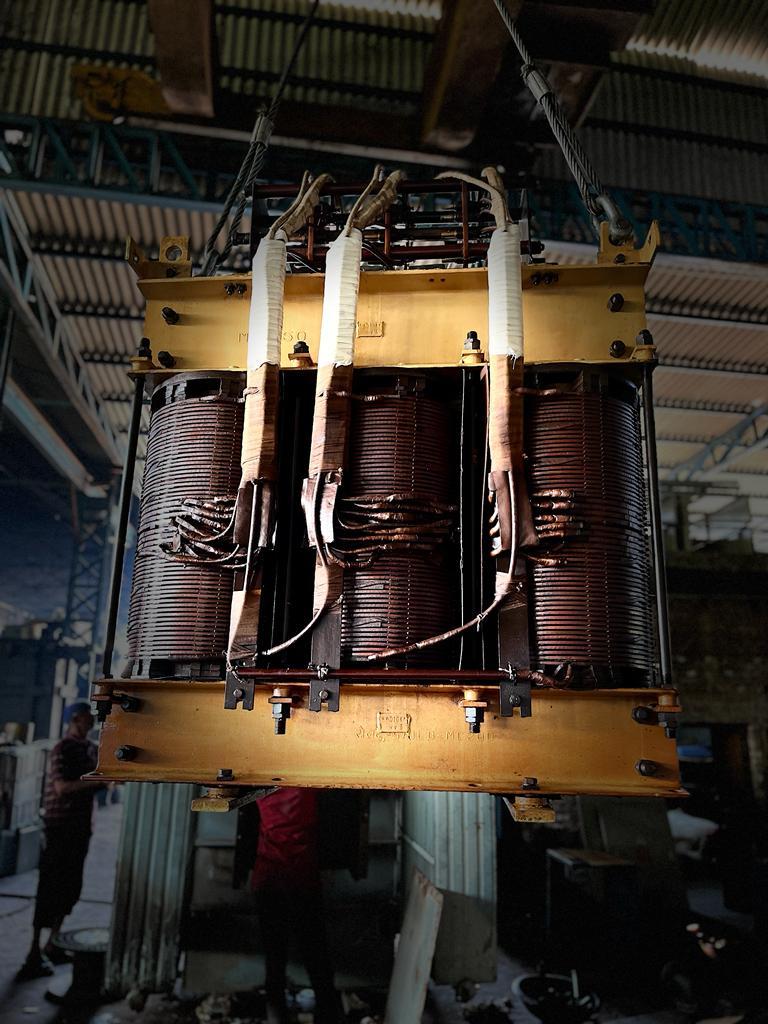 Transformer core and windings exposed during workshop rewinding